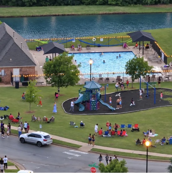 Auburn Meadows residents enjoying the pool, playground, and green space